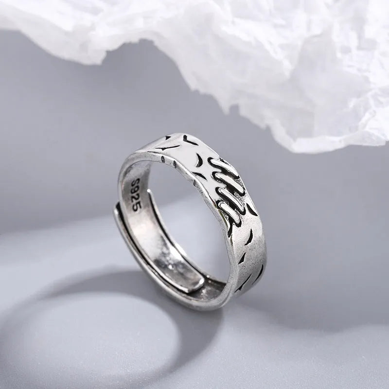 Black geometric copper ring with adjustable opening and oval design elements for women's fashion jewellery