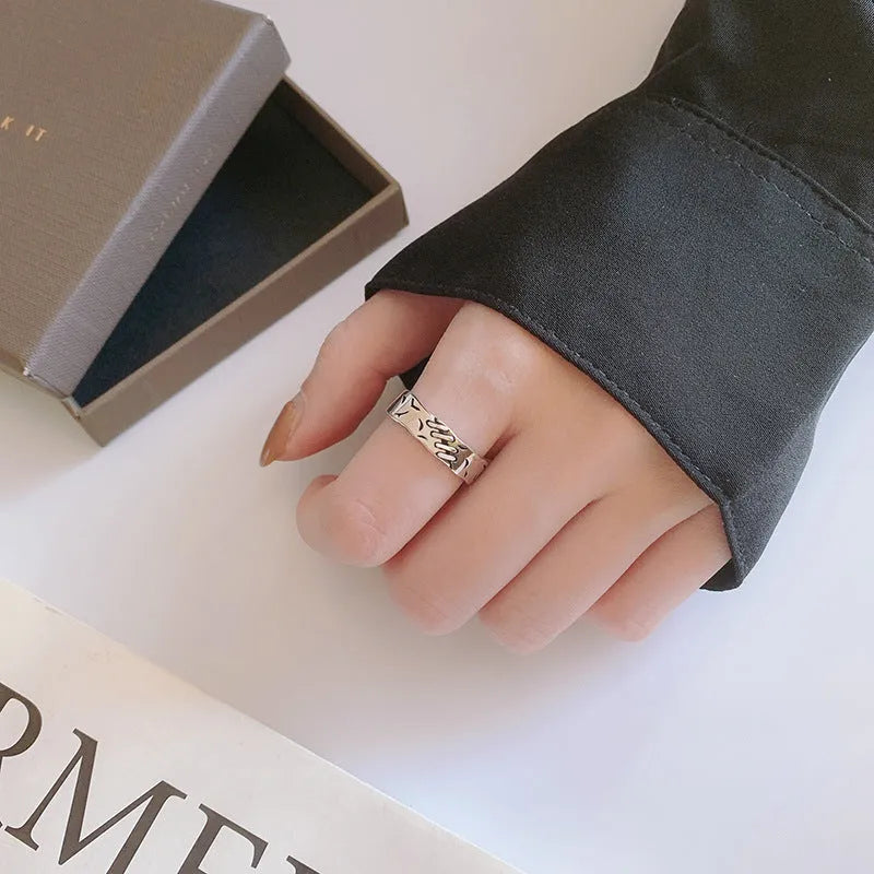Black geometric copper ring with adjustable opening and oval design elements for women's fashion jewellery