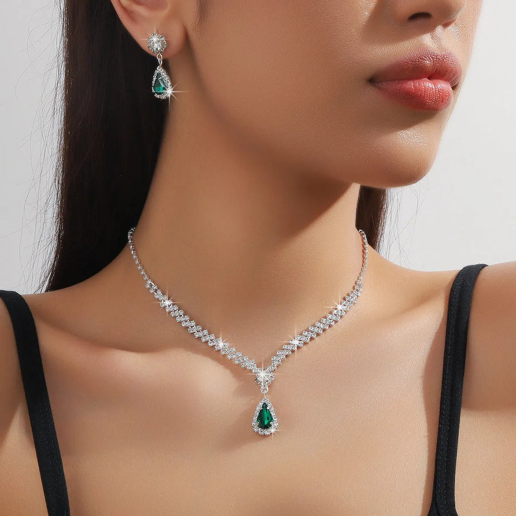 Claw chain necklace and earrings set with drop-shaped rhinestones in multiple colour options