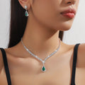Claw chain necklace and earrings set with drop-shaped rhinestones in multiple colour options