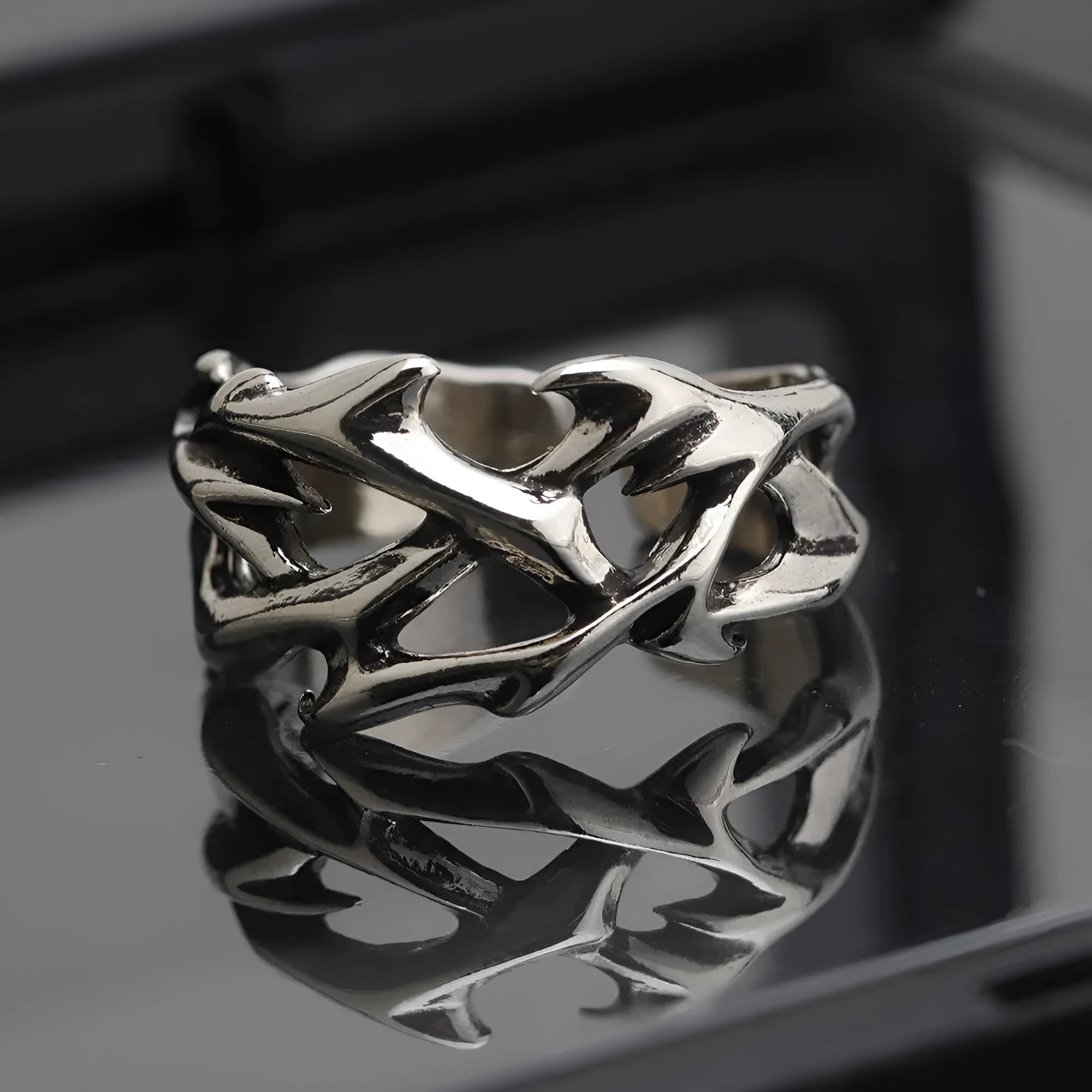 Copper thorn flower ring with adjustable opening and geometric design.