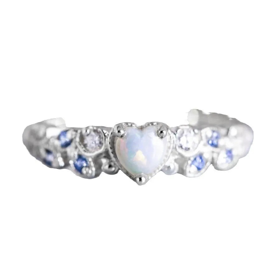 White alloy heart-shaped ring with floral opal ocean design shown in size 10.
