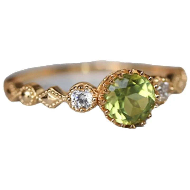 Geometric copper art ring with green imitation peridot finish in retro Japanese style.