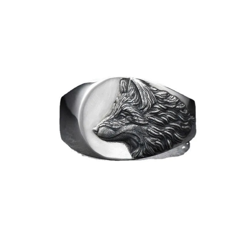 Silver geometric wolf-shaped alloy ring for men on a plain background.