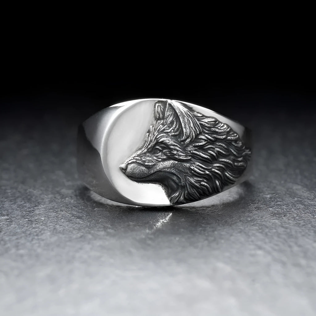 Silver geometric wolf-shaped alloy ring for men on a plain background.