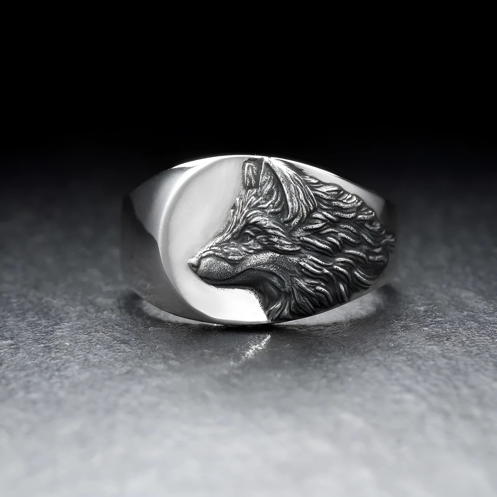 Silver geometric wolf-shaped alloy ring for men on a plain background.