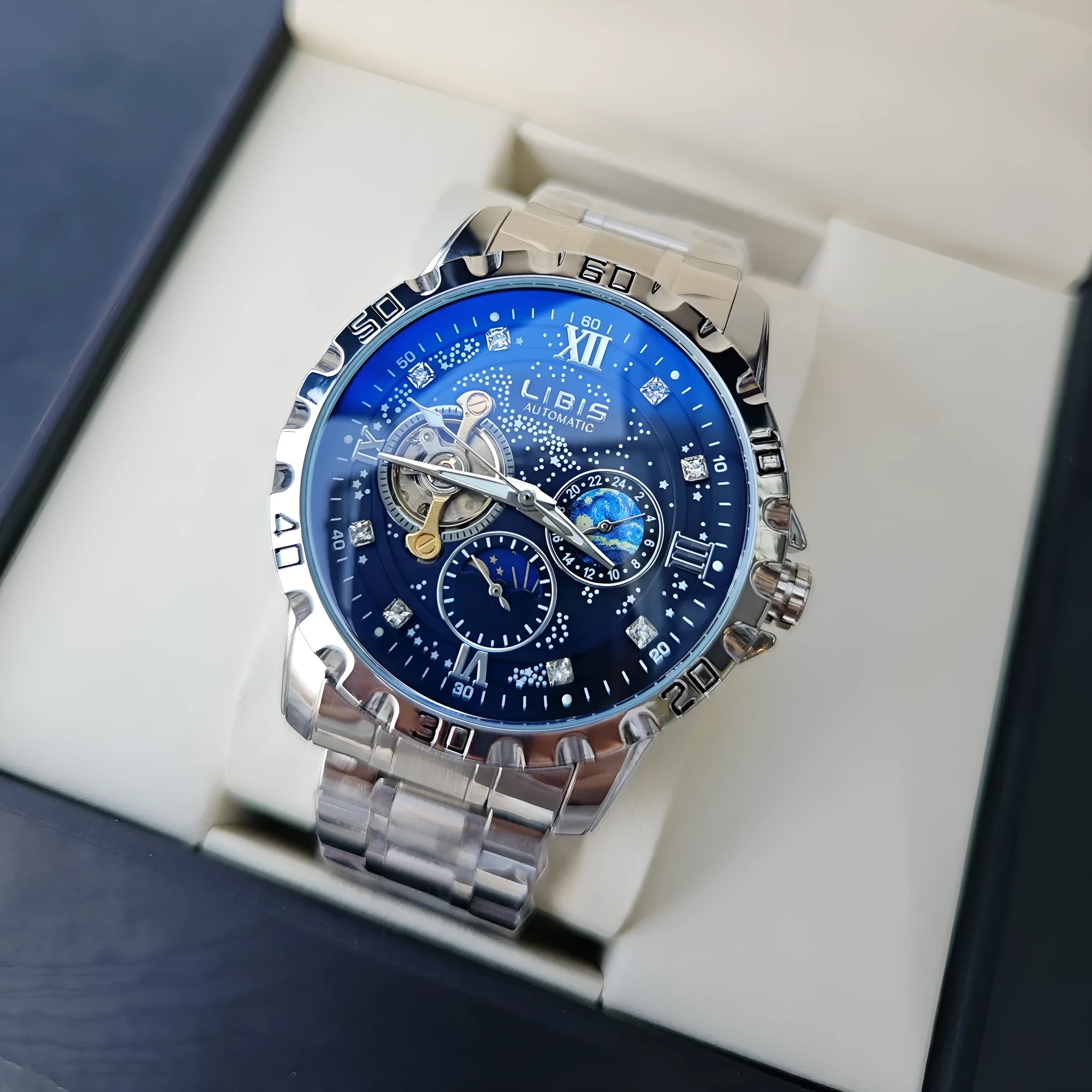 Silver case men's automatic watch with black starry dial, luminous markers, and leather strap