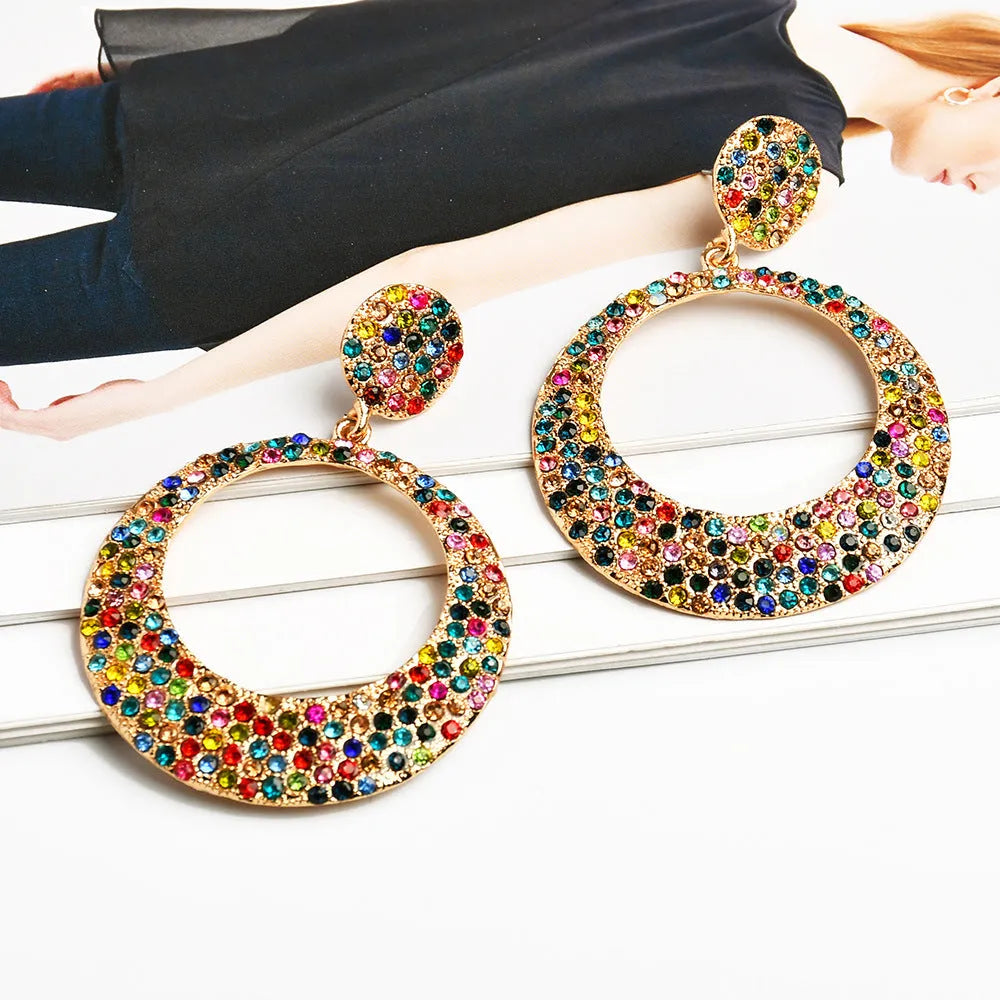 Cartoon-style metal alloy earrings with large diamond pendant drop in various colour options