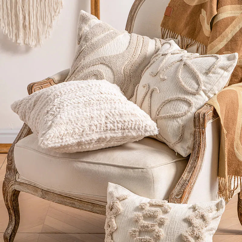 Knitted cushion cover with tassel trim in stripe pattern, available in six colours including spiral dots and woven rabbit fur