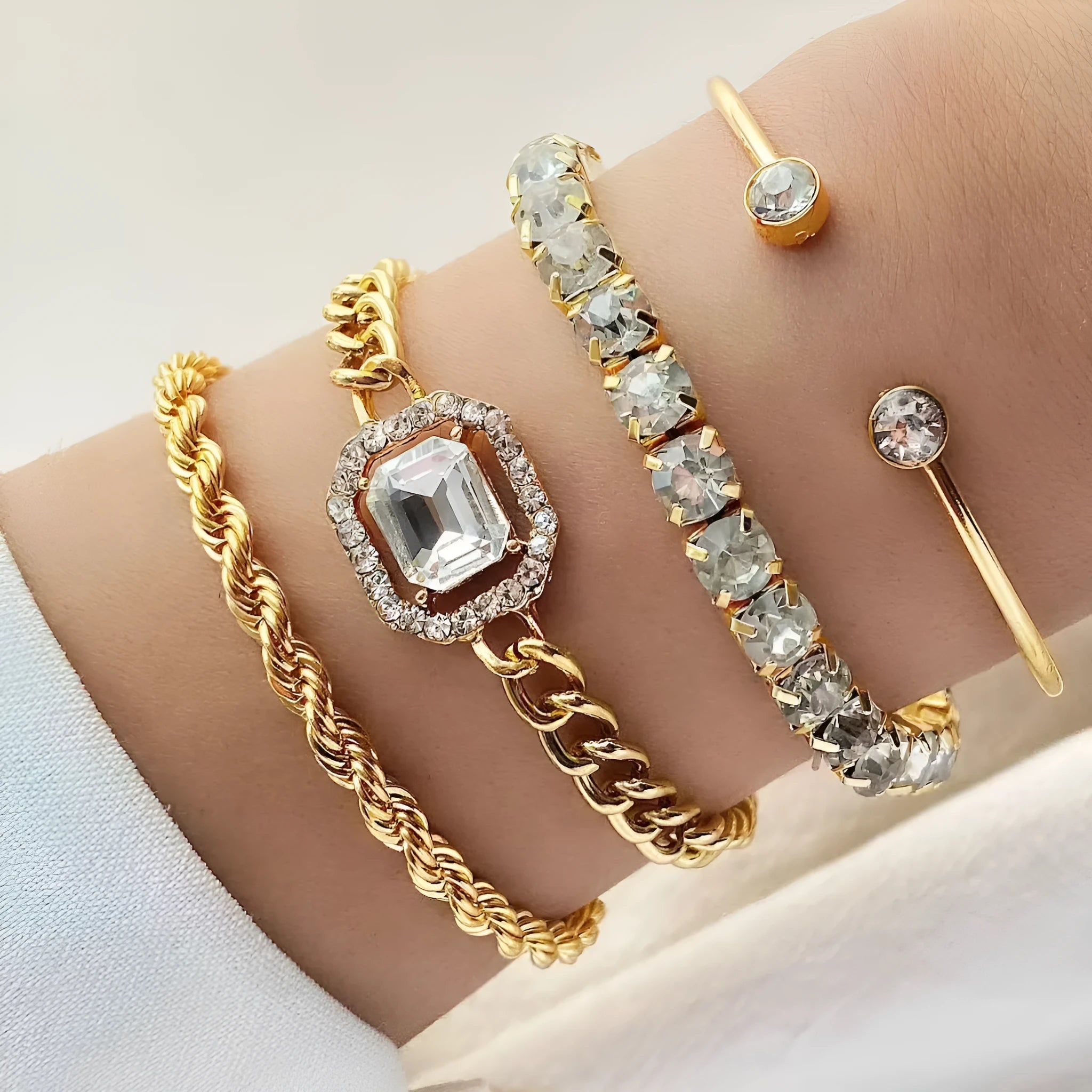 Retro style four-piece alloy bracelet set with geometric square diamond design in gold or silver finish