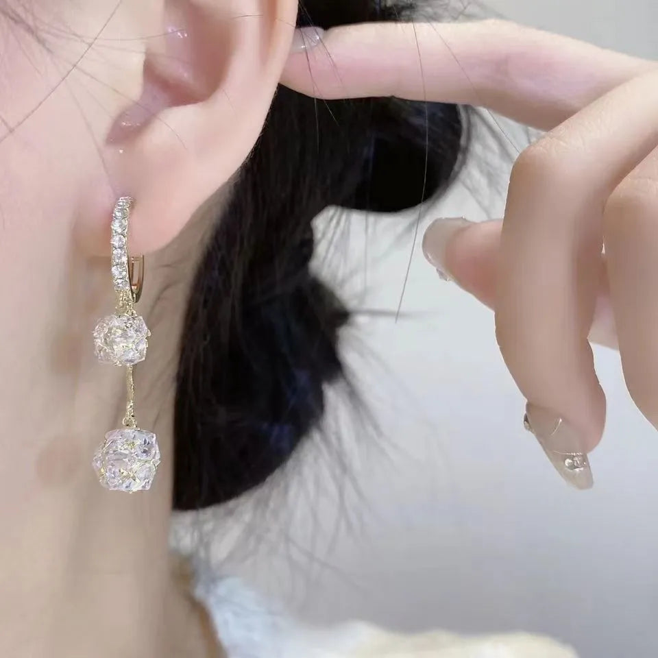 Silver-coloured copper tassel earrings with confession balloon and rhinestone ball double pendant design