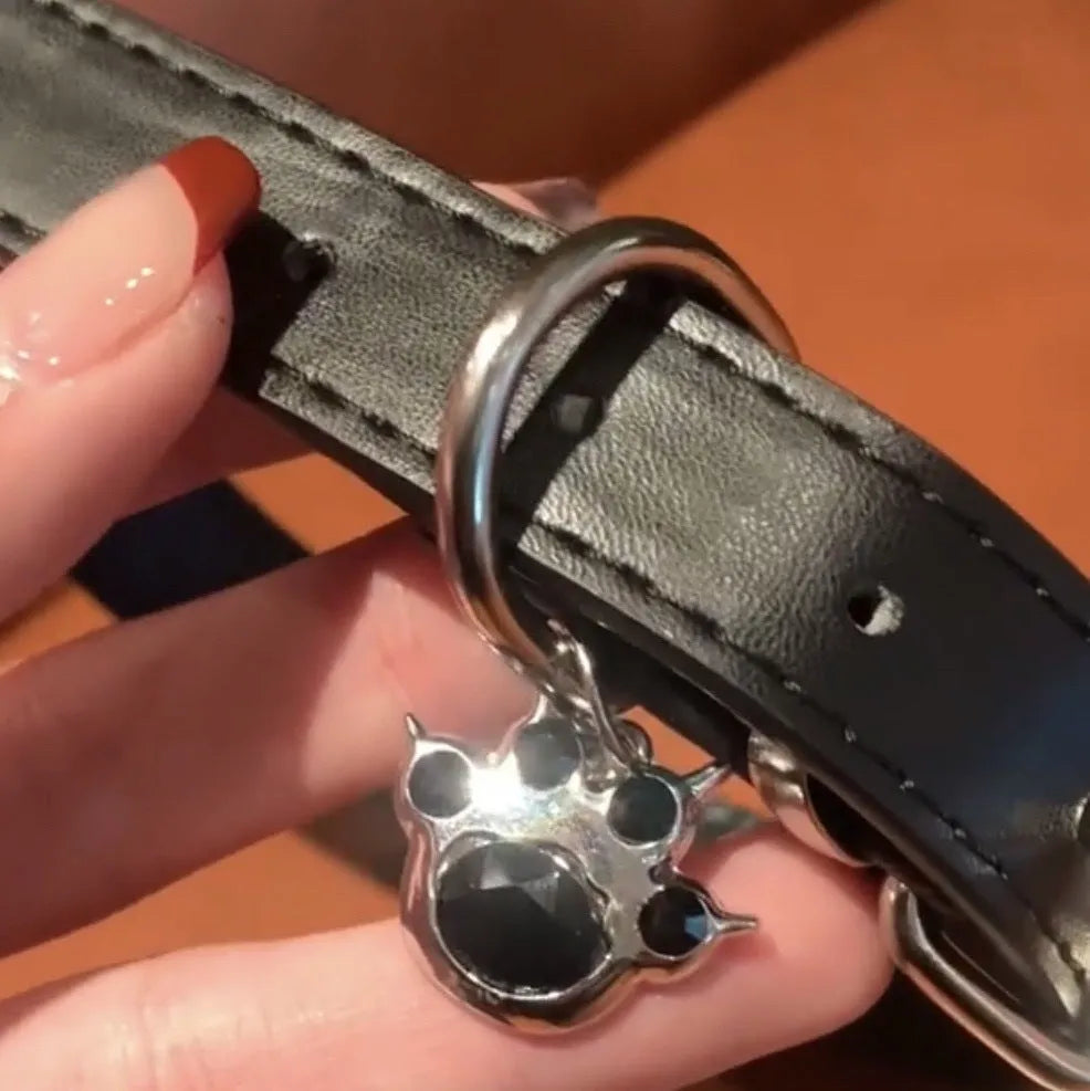 Black leather dog collar with bell pendant showing three design options adjustable from 21cm to 50cm