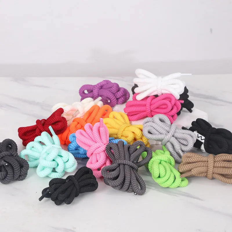 Set of oval 1.0mm wide replacement shoelaces in multiple colours including black, pink, red, and blue, shown in various lengths.