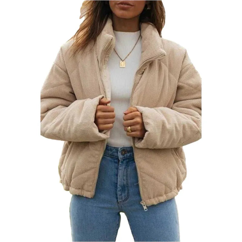 Apricot-coloured women's corduroy jacket with a stand collar and front zip, shown on a hanger.