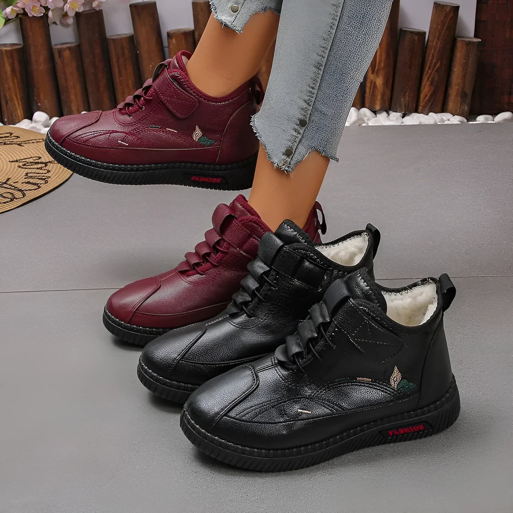 Women's black velvet cotton shoes with hollow-out design and textured rubber sole.