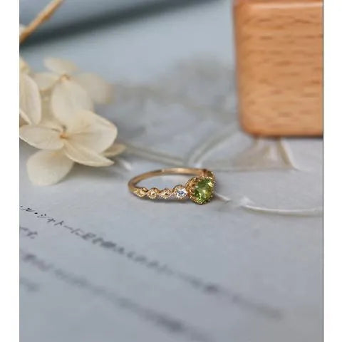 Geometric copper art ring with green imitation peridot finish in retro Japanese style.