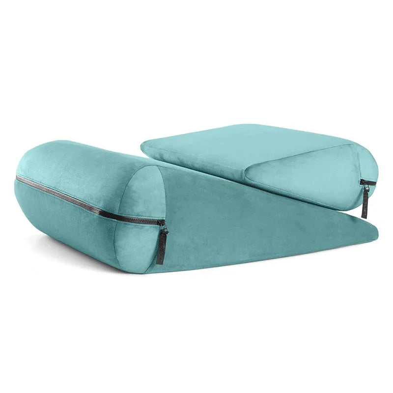 Grey triangular wedge cushion with embroidered detail on fabric, showing its dimensions for furniture support.
