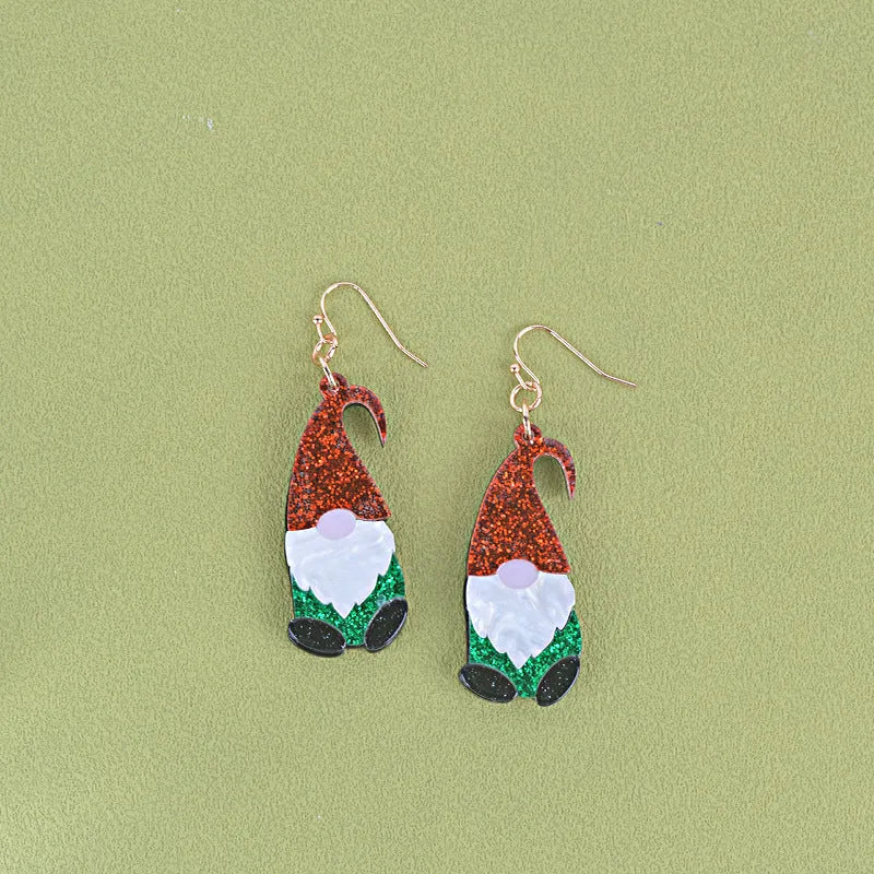 A pair of acrylic earrings shaped like cartoon Santa Claus figures with coloured hats.