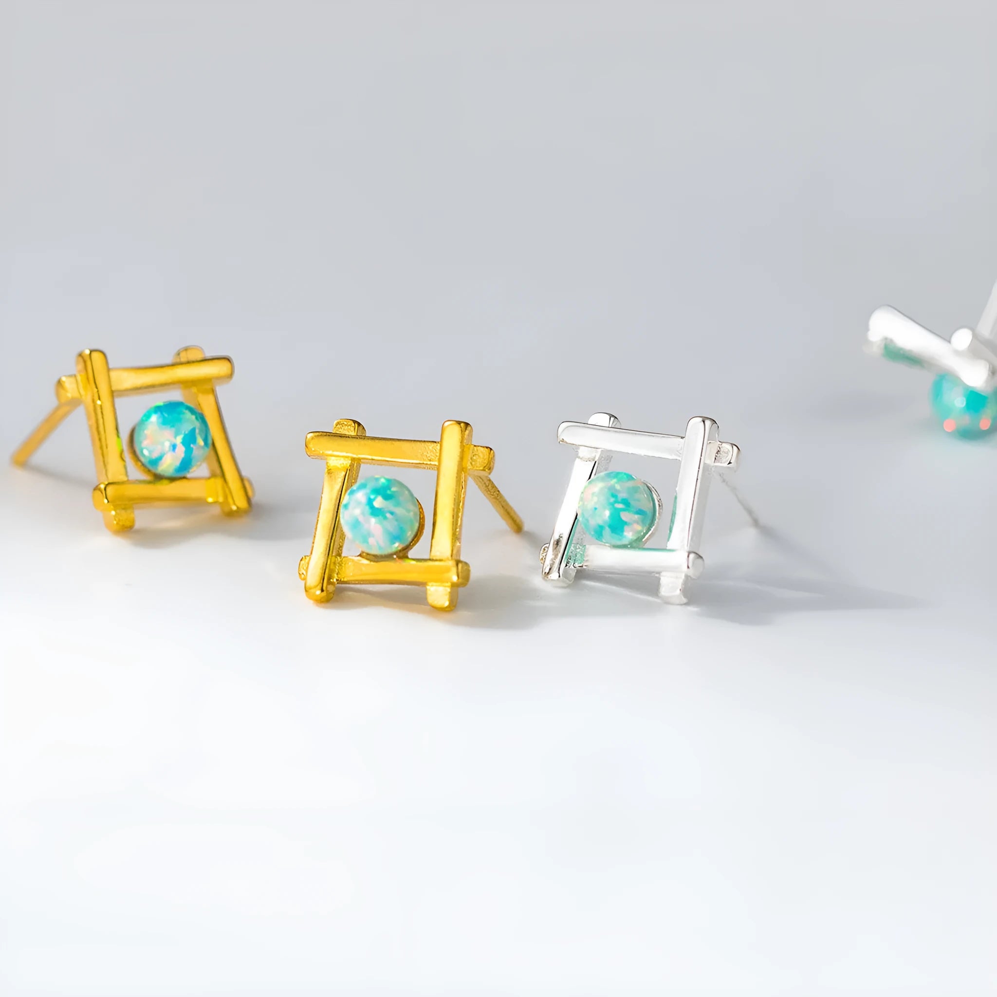 Geometric cross quadrangle sterling silver 925 stud earrings for women in gold and silver finishes.