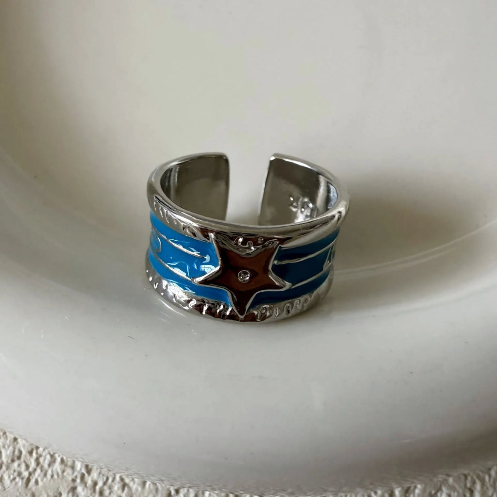 Adjustable geometric copper ring with distressed electroplated finish in multiple colour options