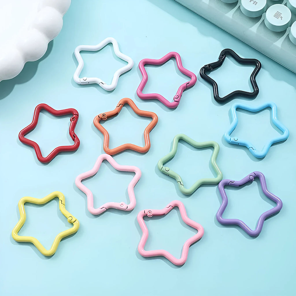 Zinc alloy five-pointed star keychain in multiple macaron colours including pink, blue, and purple