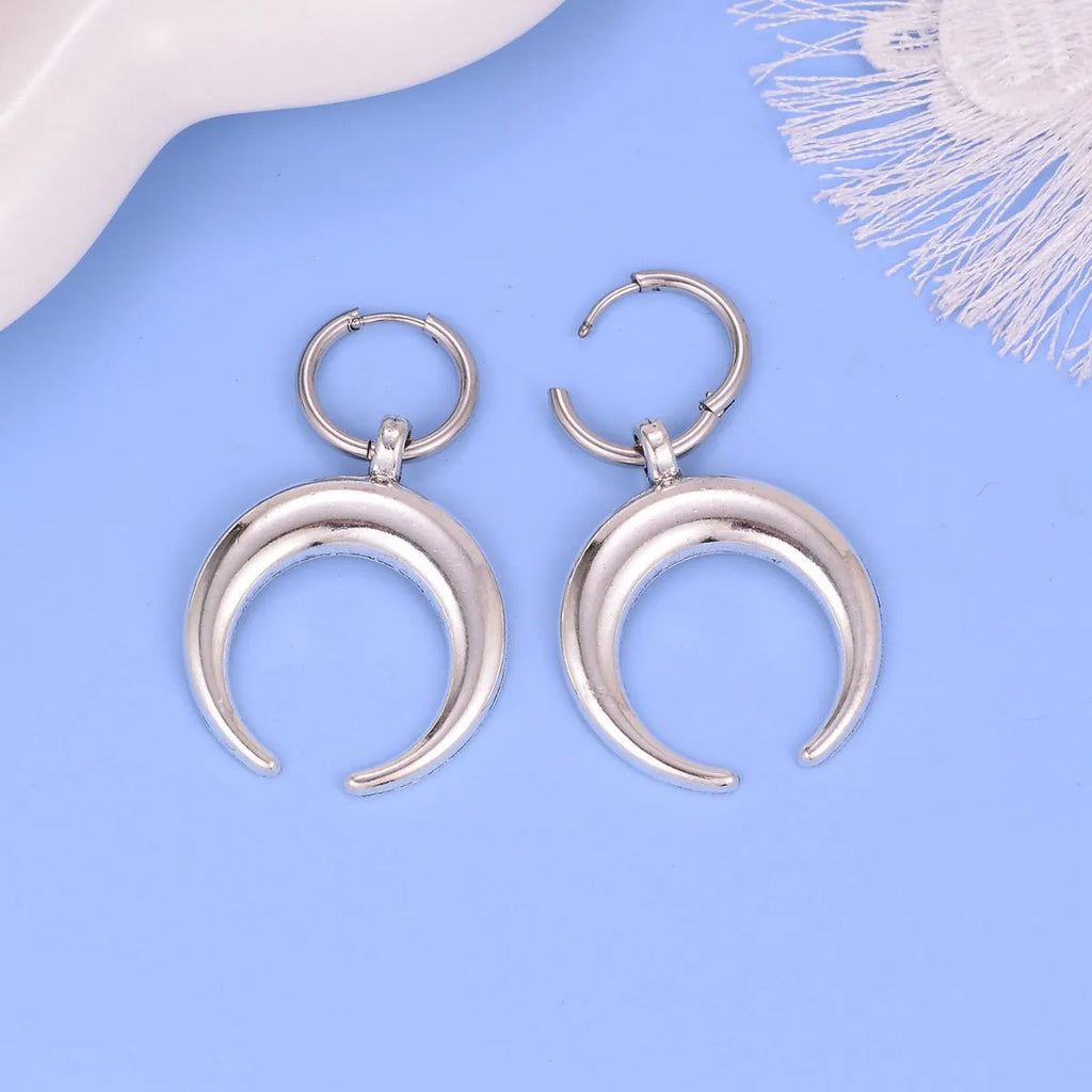Silver geometric hoop earrings with moon detail and clip fastening