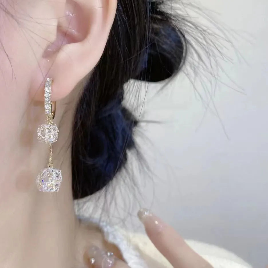 Silver-coloured copper tassel earrings with confession balloon and rhinestone ball double pendant design