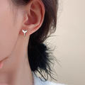 Women's fashion fishtail earrings in gold colour with simple design