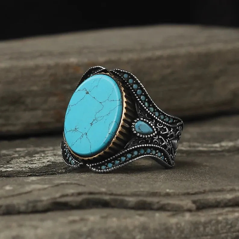 Men's antique silver alloy ring with a round band and a central turquoise gemstone.