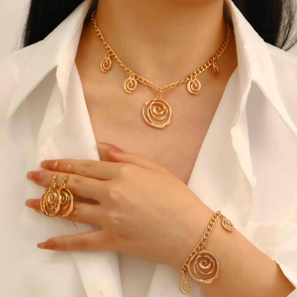 Spiral donut geometric jewellery set with necklace, bracelet, and ear hooks in gold or silver electroplated finish