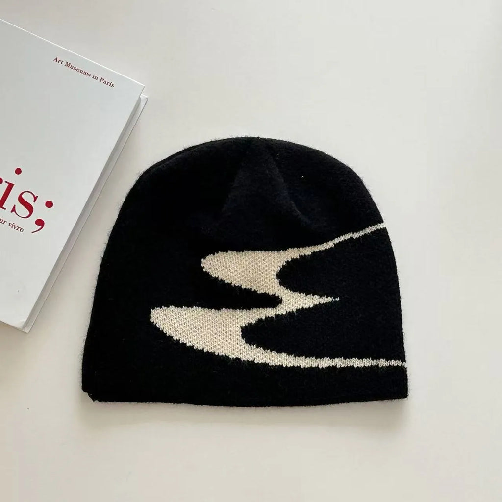 Knitted acrylic beanie hat in black, grey, or white for autumn and winter wear