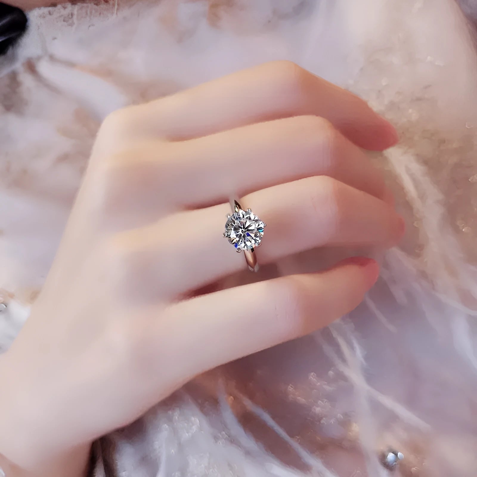 White gold plated geometric ring with six-claw setting holding a zircon stone.