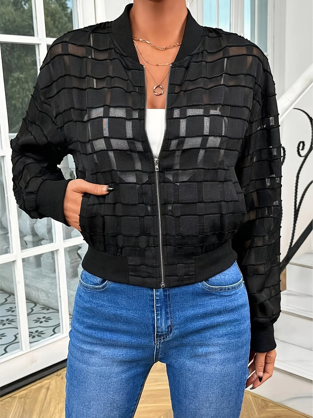 Black women's casual jacket with geometric pattern and semi-transparent thread zipper.
