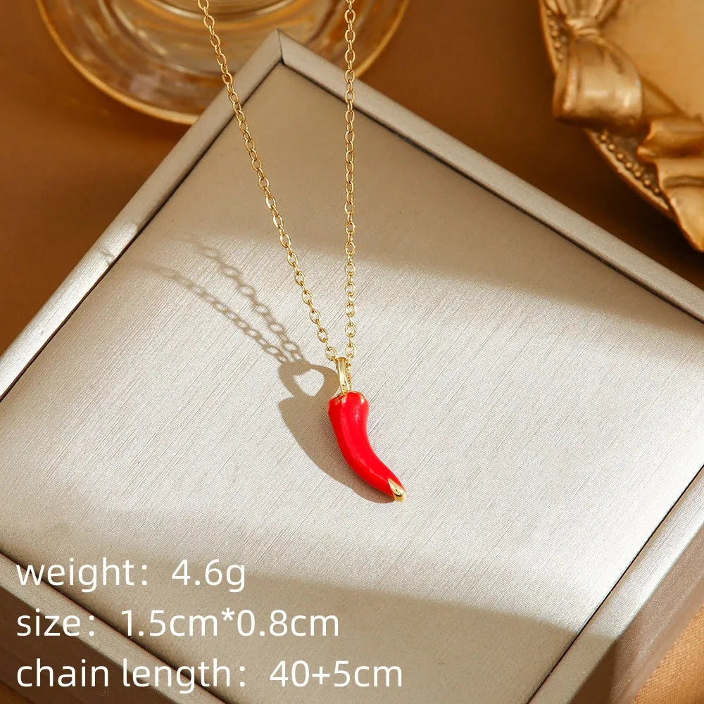 Indie fashion necklace with delicate cherry, strawberry and pepper pendant on a titanium steel O-ring chain.