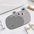 Diatomaceous earth bathroom mat with animal cartoon design in shower setting