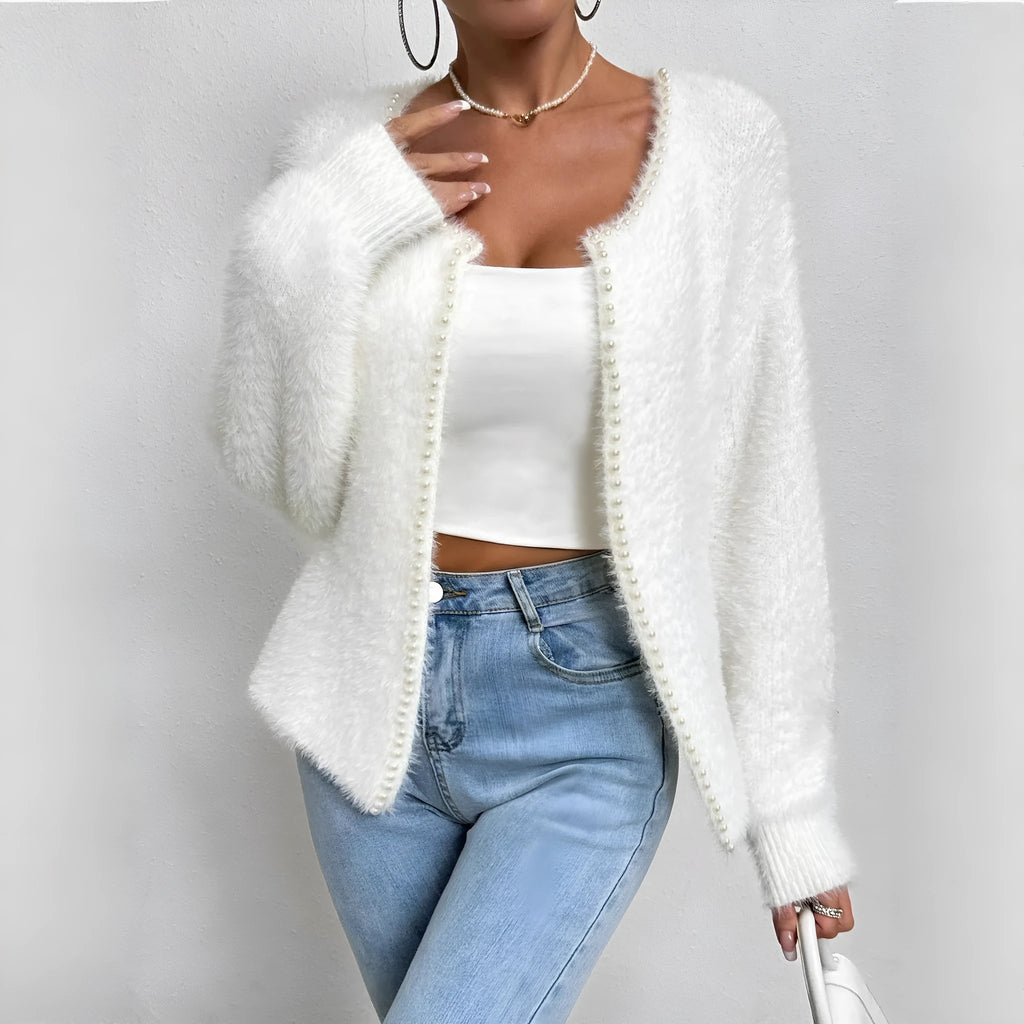 White V-neck women's cardigan sweater made from polyester knit fabric.