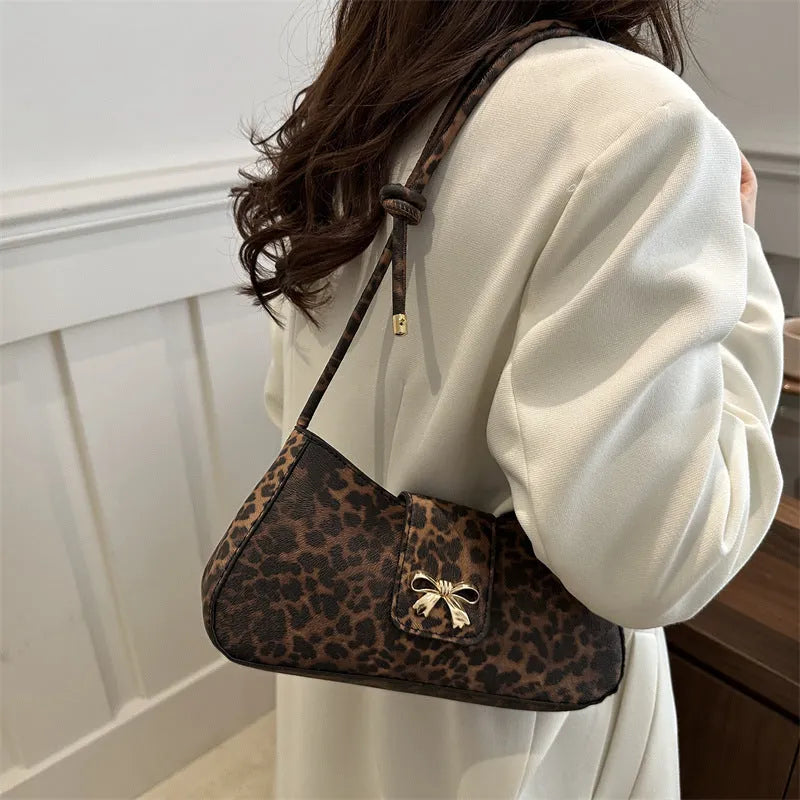 Casual large capacity PU handbag for women in black, shown with outer sandwich pocket.