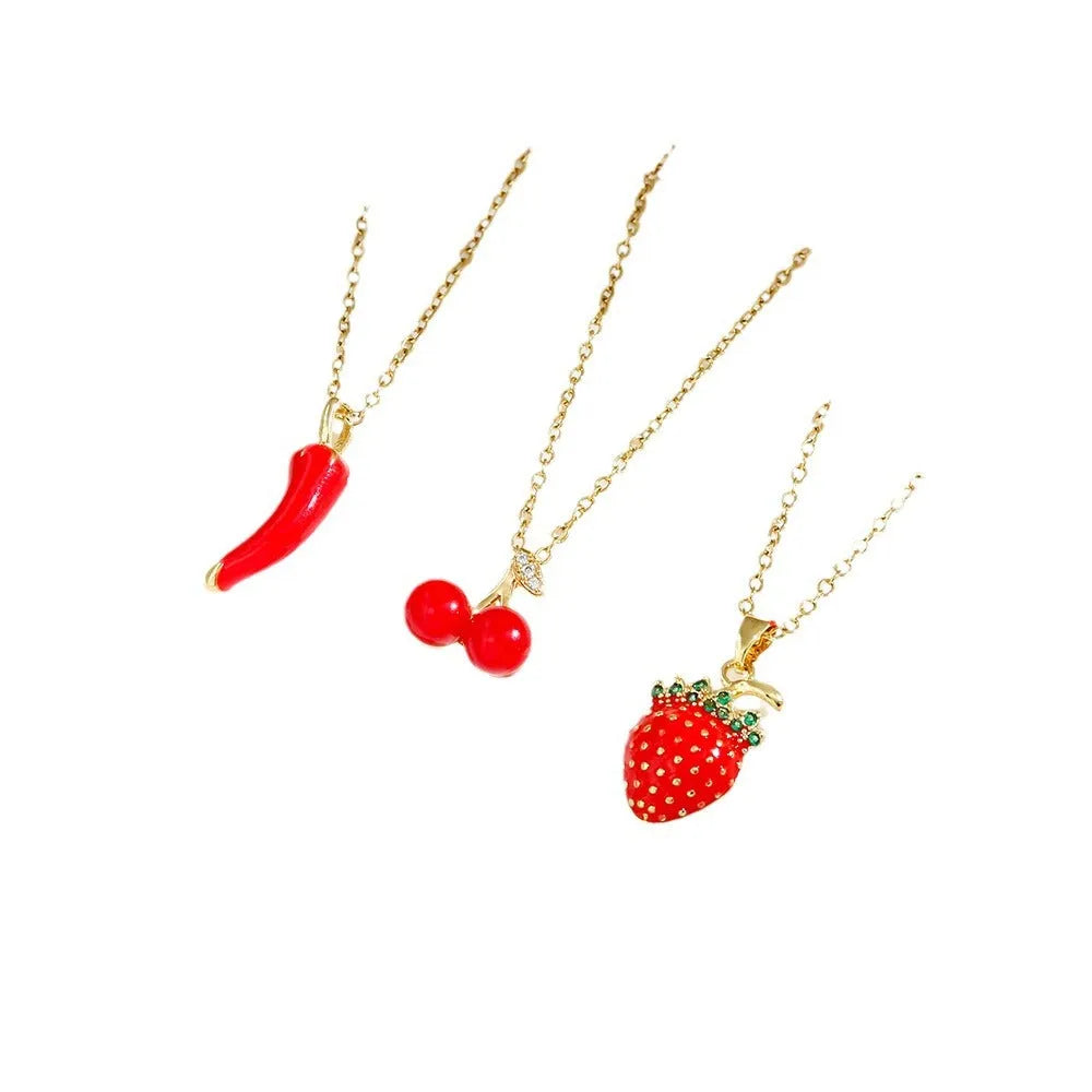 Indie fashion necklace with delicate cherry, strawberry and pepper pendant on a titanium steel O-ring chain.