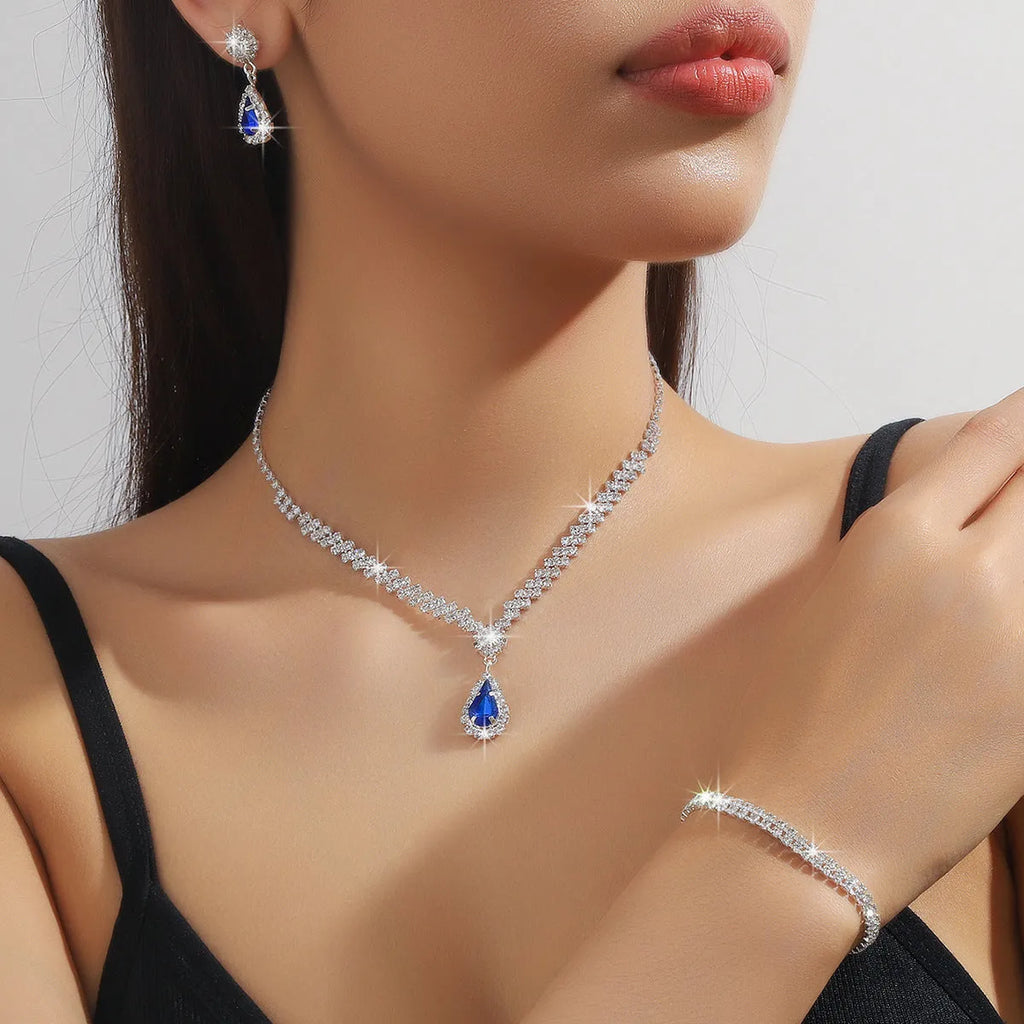 Claw chain necklace and earrings set with drop-shaped rhinestones in multiple colour options