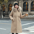 Women's long beige trench coat with fleece lining and button front.