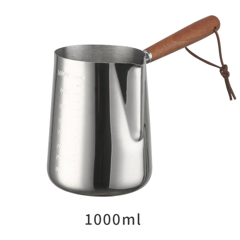 Stainless steel garland coffee cup with a scaled wooden handle shown in a simple solid colour.