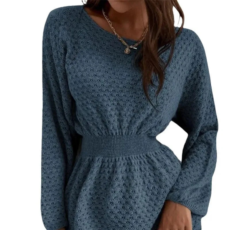 Blue women's knit dress with loose round neck, fitted waist, and hand-crocheted flower decoration