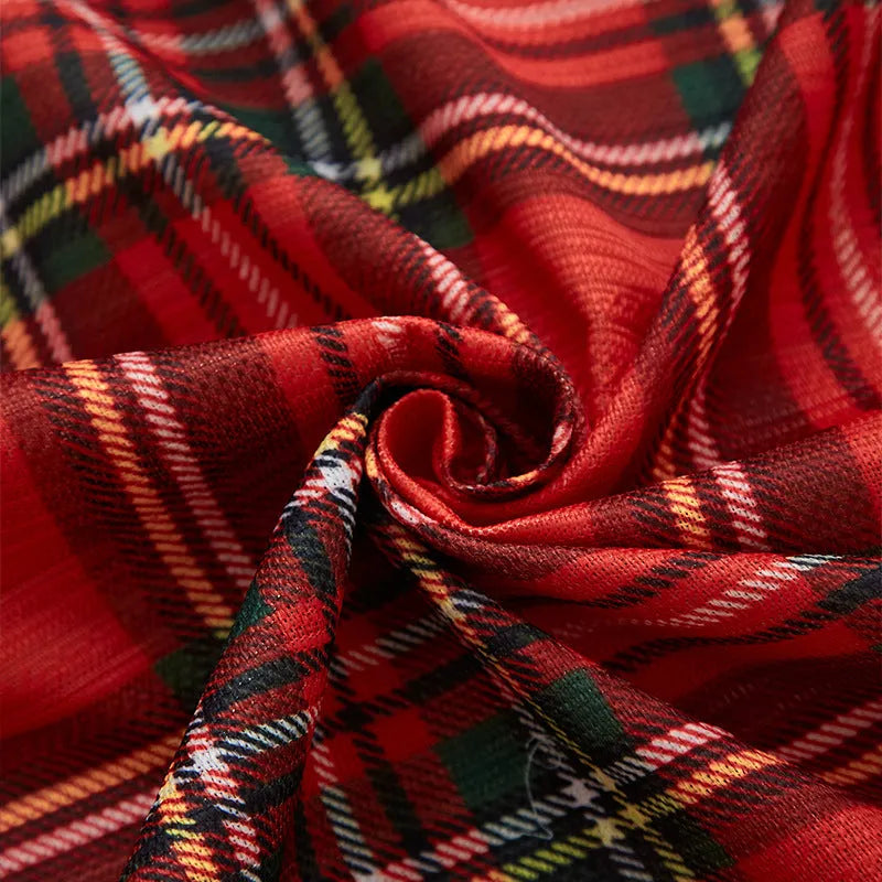 Rectangular printed Christmas curtain with semi-sunshade fabric on a window.
