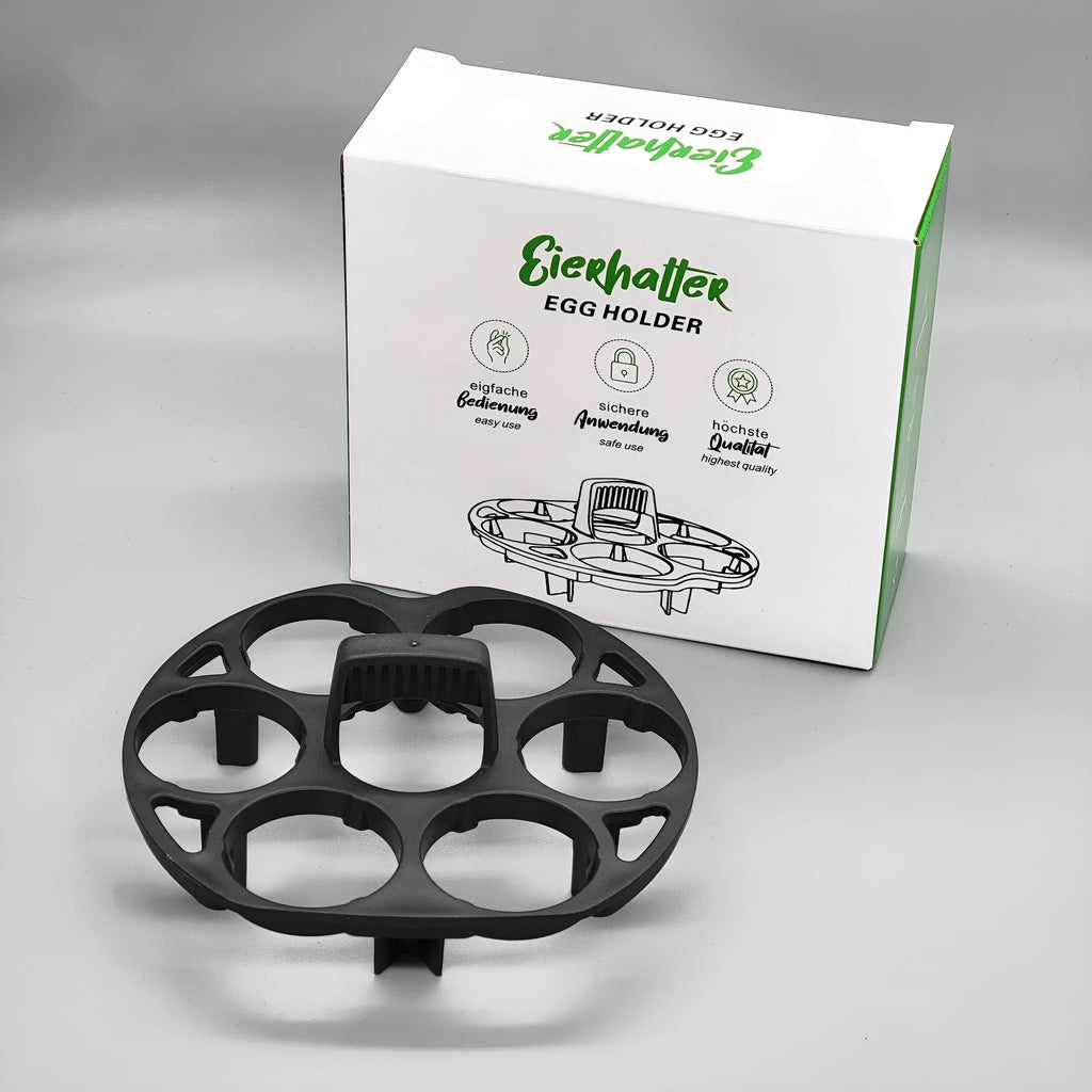 A black plastic egg holder rack for kitchen cooking machine storage, shown with dimensions.