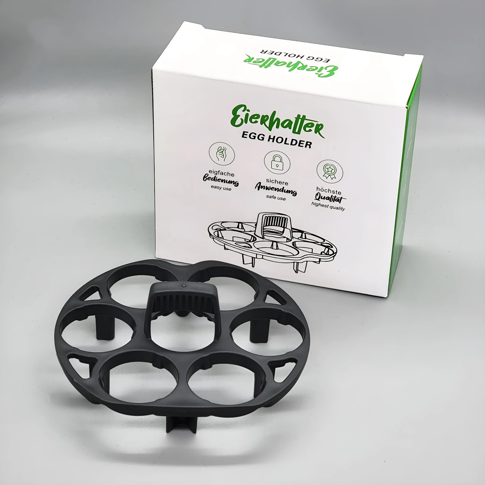 A black plastic egg holder rack for kitchen cooking machine storage, shown with dimensions.