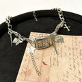 Dark multi-layer women's necklace with cross pendant and twin adjustable clavicle chains