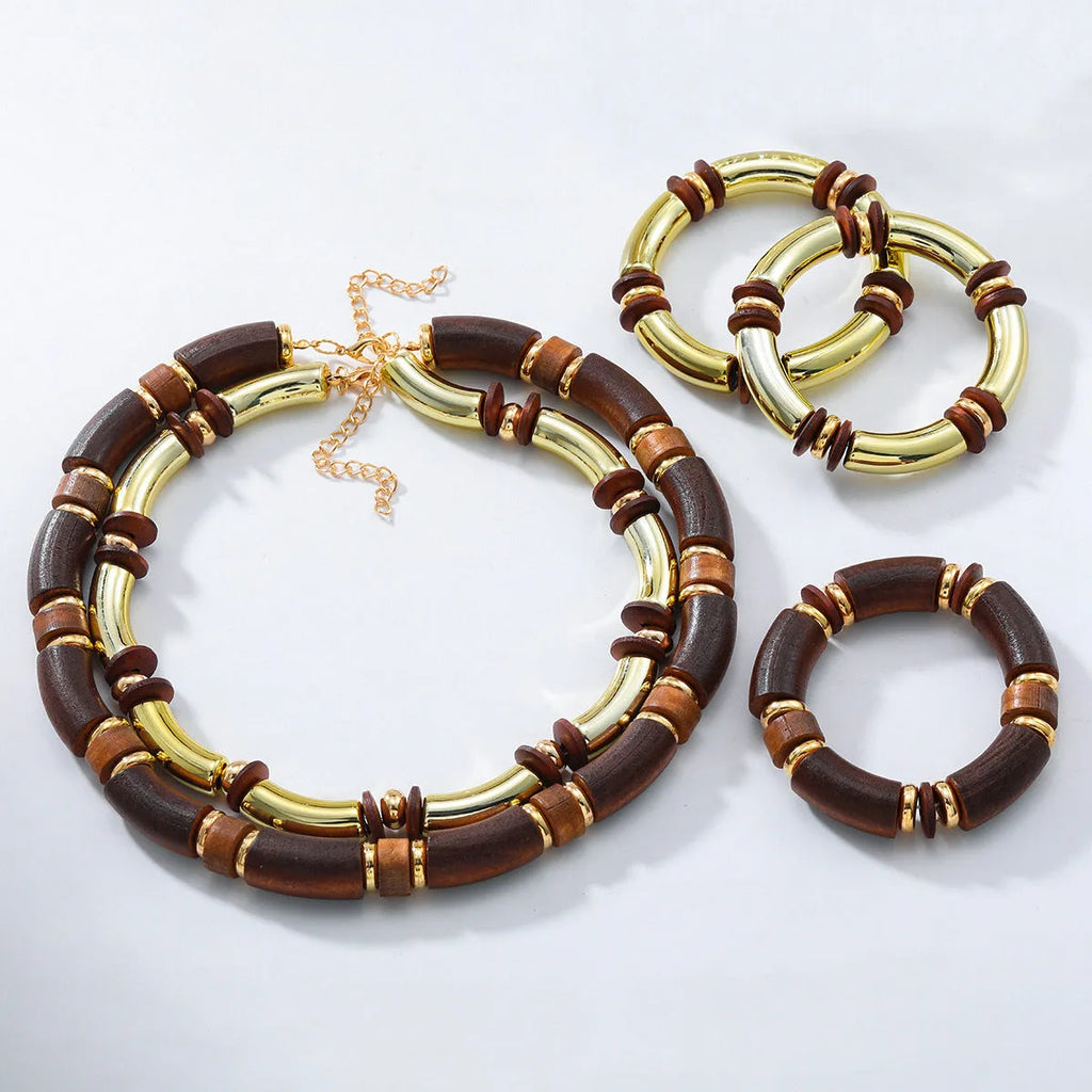 Alloy multi-layer necklace and bracelet set for women in silver tone with round details.