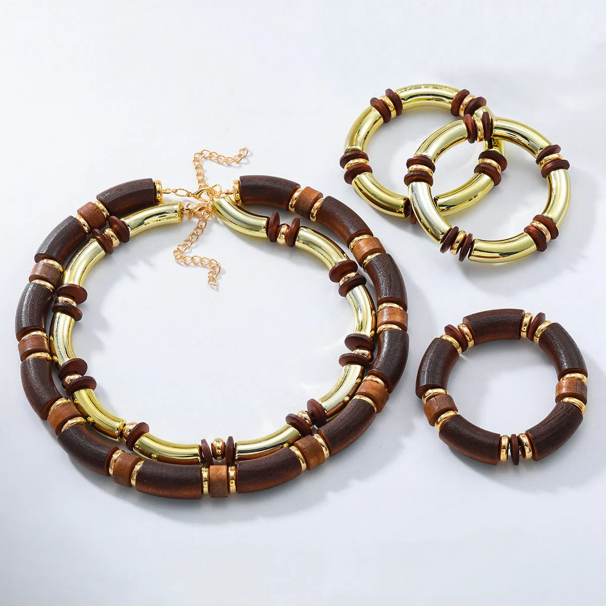 Alloy multi-layer necklace and bracelet set for women in silver tone with round details.