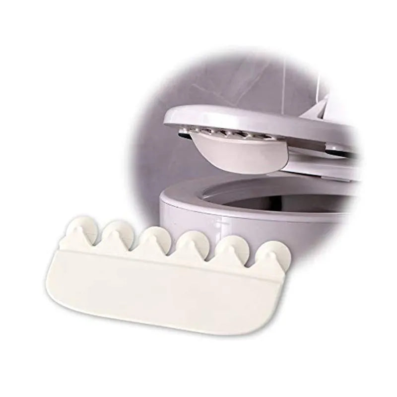 White PVC toilet training splash guard placed on a toilet seat.