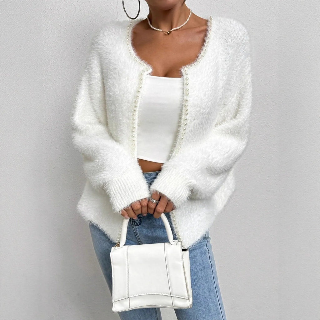 White V-neck women's cardigan sweater made from polyester knit fabric.